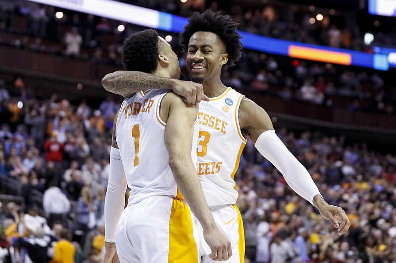 AP photo by John Minchillo / Tennessee's Jordan Bowden, right, and Lamonte Turner celebrate after the Vols beat Iowa in the second round of the NCAA tournament on March 24 in Columbus, Ohio.