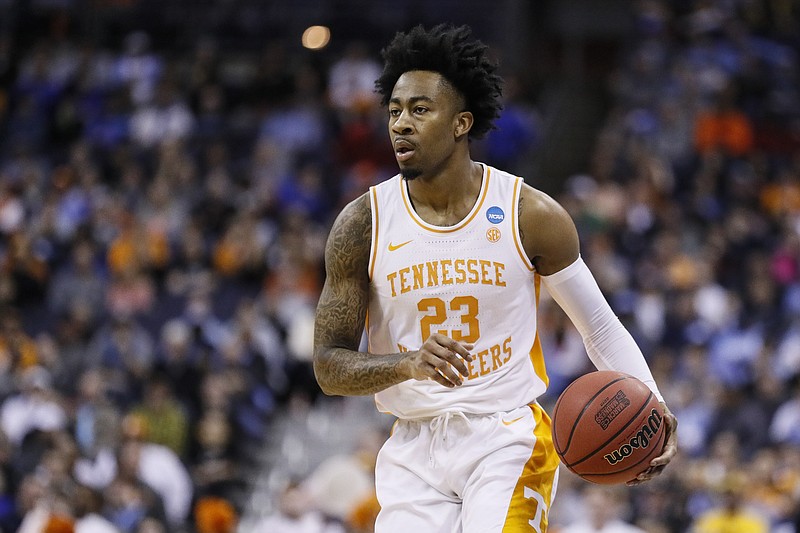 AP photo by John Minchillo / Tennessee's Jordan Bowden sets up a play during an NCAA tournament second-round game against Iowa on March 24 in Columbus, Ohio. Bowden started 36 of the Vols' 37 games last season.