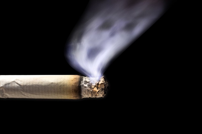 Death by smoking cigarettes - stock photo smoke smoking cigarette tile / Getty Images
