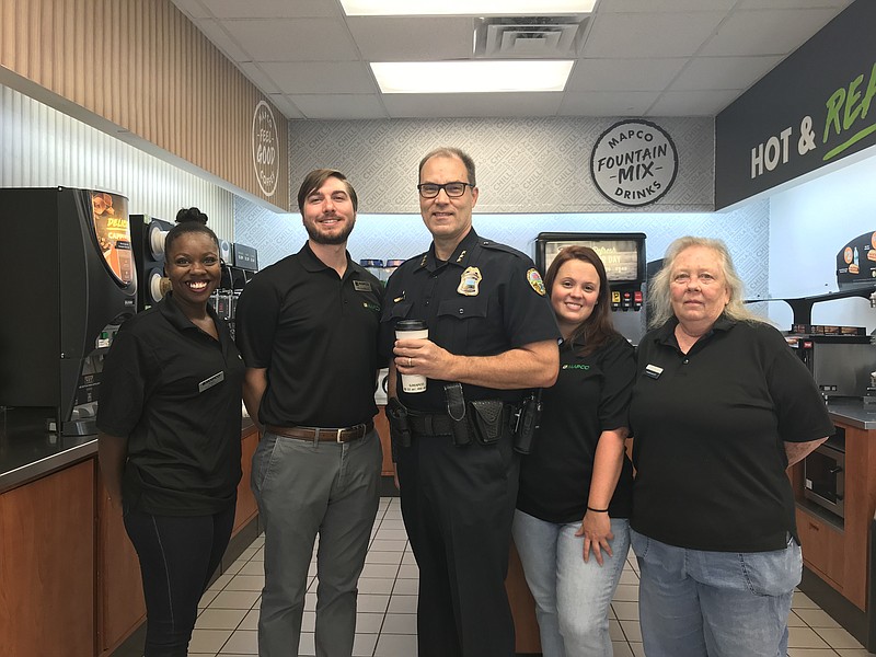 Staff photo by Sabrina Bodon / Mapco Express staff members enjoy coffee with Chattanooga Police Deputy Chief Eric Tucker, center.