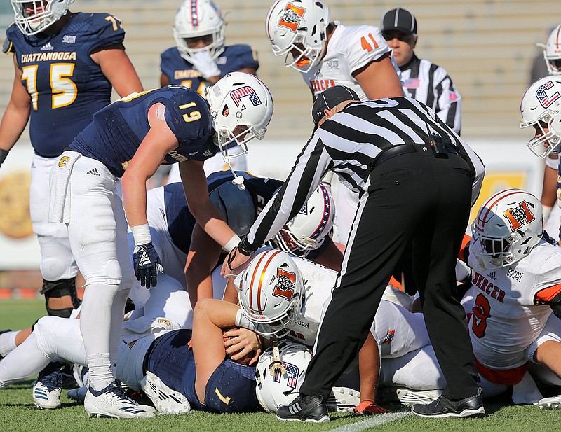 Staff photo by Erin O. Smith / UTC quarterback Nick Tiano (7) comes up just short of the end zone during the first half of the Mocs' loss to Mercer in November 2018 at Finley Stadium.