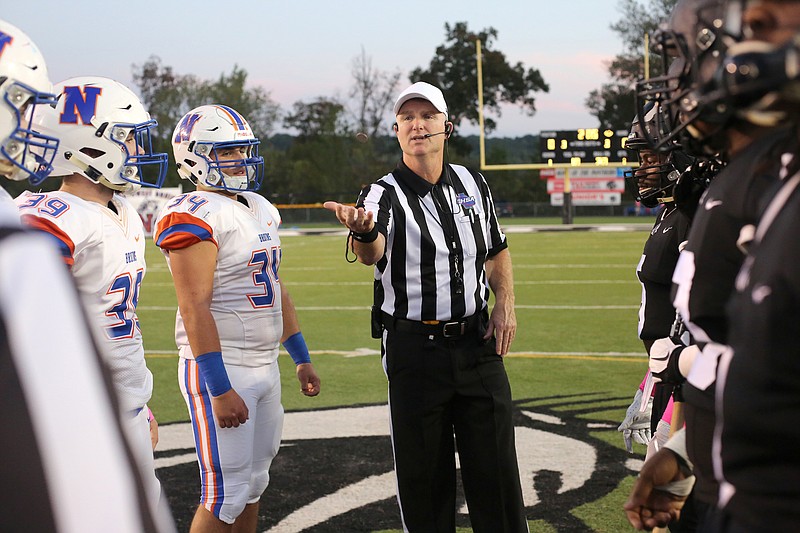 Staff photo by Erin O. Smith / The referee flips the coin before Ridgeland's football game against Northwest Whitfield on Friday night in Rossville, Ga.