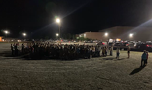 Dade County High School students circle around band members after the homecoming parade after learning one of the band member's lost her life in a car crash Thursday night. Photo provided by Dade County Schools
