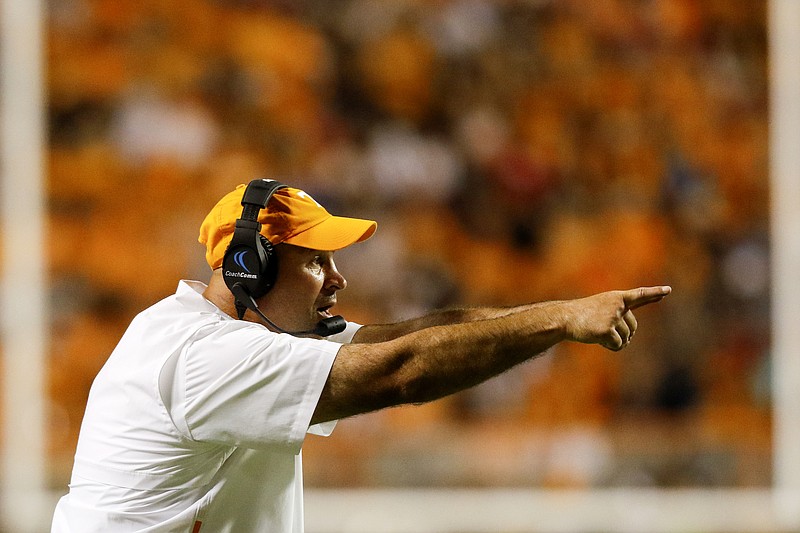 Staff photo by C.B. Schmelter / Tennessee football coach Jeremy Pruitt signals to his team during Saturday night's game against SEC East rival Georgia.