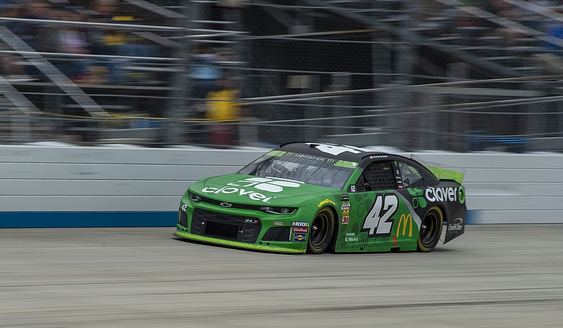 AP photo by Jason Minto / Kyle Larson races at Dover International Speedway on Sunday on the way to winning the first NASCAR Cup Series playoff event of the second round.