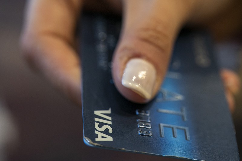 FILE - This Aug. 11, 2019, photo shows a Chase Bank Slate credit card in New Orleans. On Monday, Oct. 7, the Federal Reserve releases its August report on consumer borrowing. (AP Photo/Jenny Kane, File)