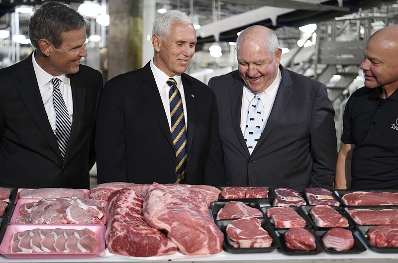 Tennessee Gov. Bill Lee, U.S. Vice President Mike Pence, Secretary of Agriculture Sonny Perdue and Tyson Foods plant manager Doug Griffin stand together during the vice president's visit to Tyson Foods Monday, Oct. 7, 2019 in Goodlettsville, Tenn. (George Walker IV/The Tennessean via AP)