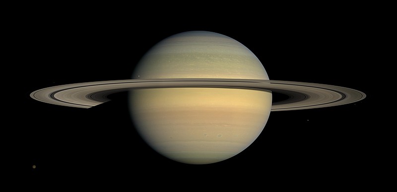 This July 23, 2008, file image made available by NASA shows the planet Saturn, as seen from the Cassini spacecraft. Twenty new moons have been found around Saturn, giving the ringed planet a total of 82, scientists said Monday, Oct. 7, 2019. (NASA/JPL/Space Science Institute via AP, File)