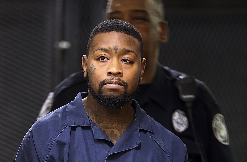 In this Thursday, Aug. 18, 2016, file photo, Brenden Burns is led into Jackson City Court for a preliminary hearing before Judge Blake Anderson in Jackson, Tenn. Convicted felon Burns was sentenced to life in prison, Monday, Oct. 7, 2019, for killing Tennessee Bureau of Investigation Special Agent De'Greaun Frazier in August 2016. (C.B. Schmelter/The Jackson Sun via AP, File)