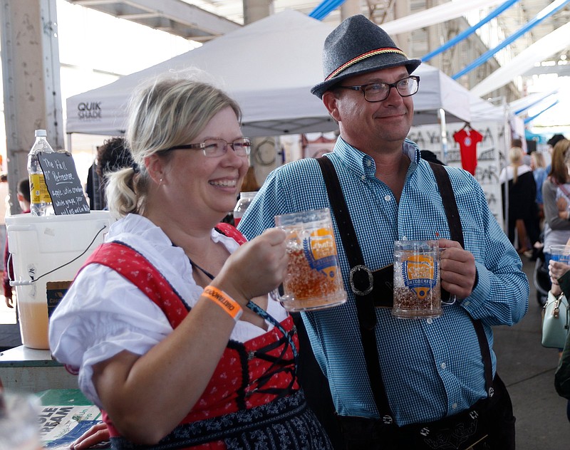 Staff File Photo / Meredith and Joe Coke enjoy beers during the Chattanooga Market's 2018 Oktoberfest celebration in First Tennessee Pavilion.