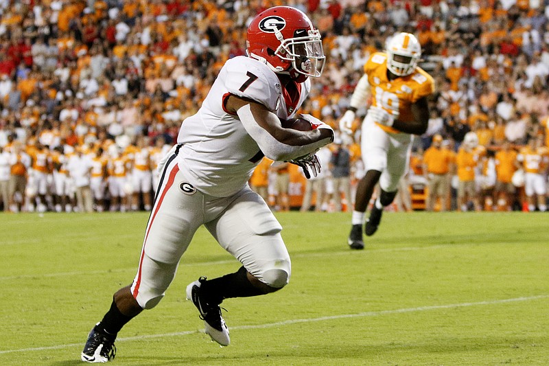 Staff photo by C.B. Schmelter / Georgia running back D'Andre Swift (7) turns up field after making a catch against Tennessee at Neyland Stadium on Saturday, Oct. 5, 2019 in Knoxville, Tenn.