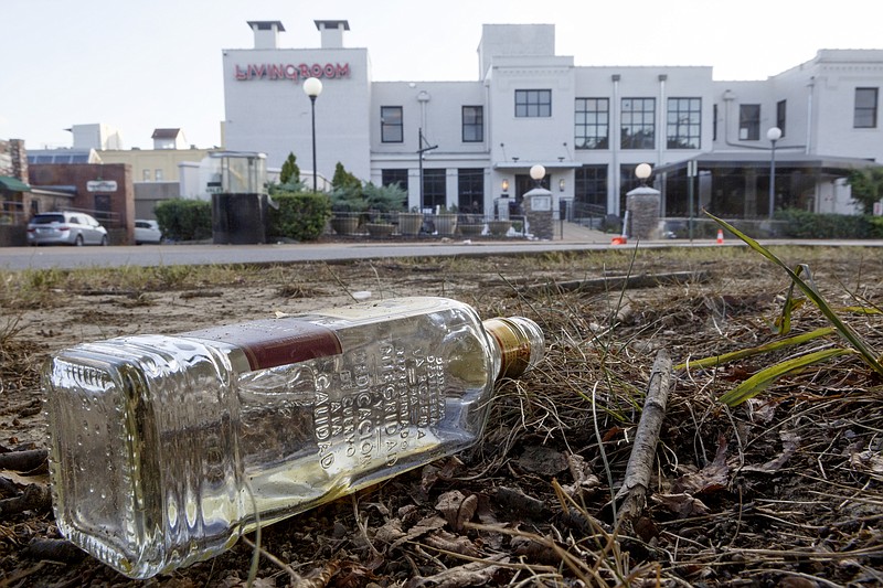 Staff photo by C.B. Schmelter / A discarded bottle of tequila is seen across the street from Coyote Jack's on Tuesday, Oct. 8, 2019 in Chattanooga, Tenn.