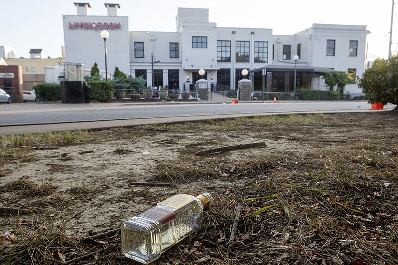 Staff photo by C.B. Schmelter / A discarded bottle of tequila is seen across the street from Coyote Jack's on Tuesday, Oct. 8, 2019 in Chattanooga, Tenn.