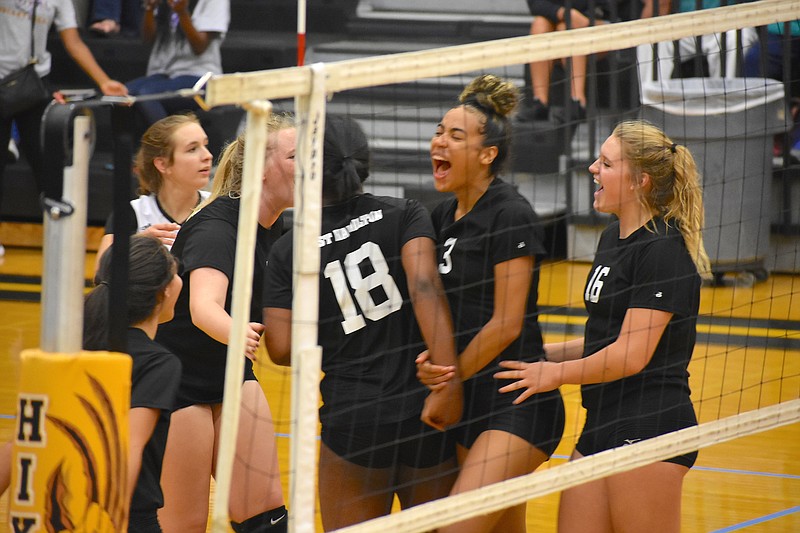 Staff photo by Patrick MacCoon / East Hamilton celebrates after scoring a point in the District 6-AA championship match Tuesday night against Hixson. The Lady Hurricanes won 3-0 at Hixson.