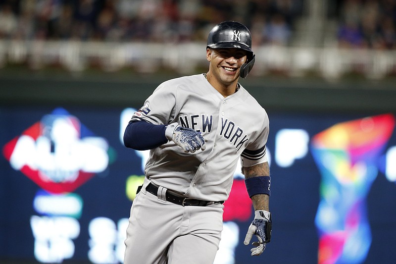 New York Yankees' Gleyber Torres celebrates as he runs the bases after hitting a home run during the second inning in Game 3 of a baseball American League Division Series against the Minnesota Twins, Monday, Oct. 7, 2019, in Minneapolis. (AP Photo/Bruce Kluckhohn)