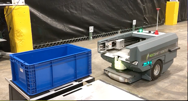 A NextShift robot picks up a container during a tour of the Innovation Labs at Kenco Logistics on Tuesday, Oct. 8, 2019. / Screenshot from video by C.B. Schmelter
