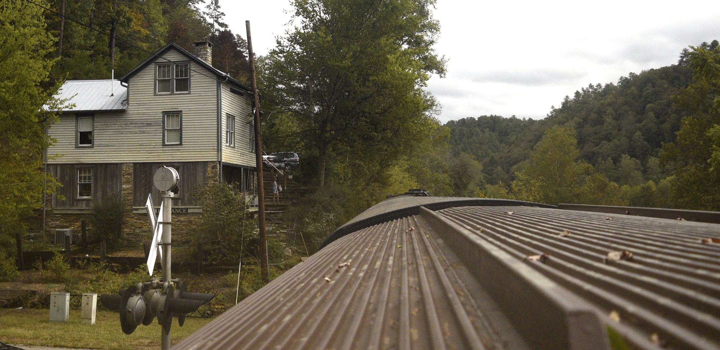 Staff Photo by Robin Rudd/ The historic Bridgetender's House in Reliance is seen from one of the dome car's windows.