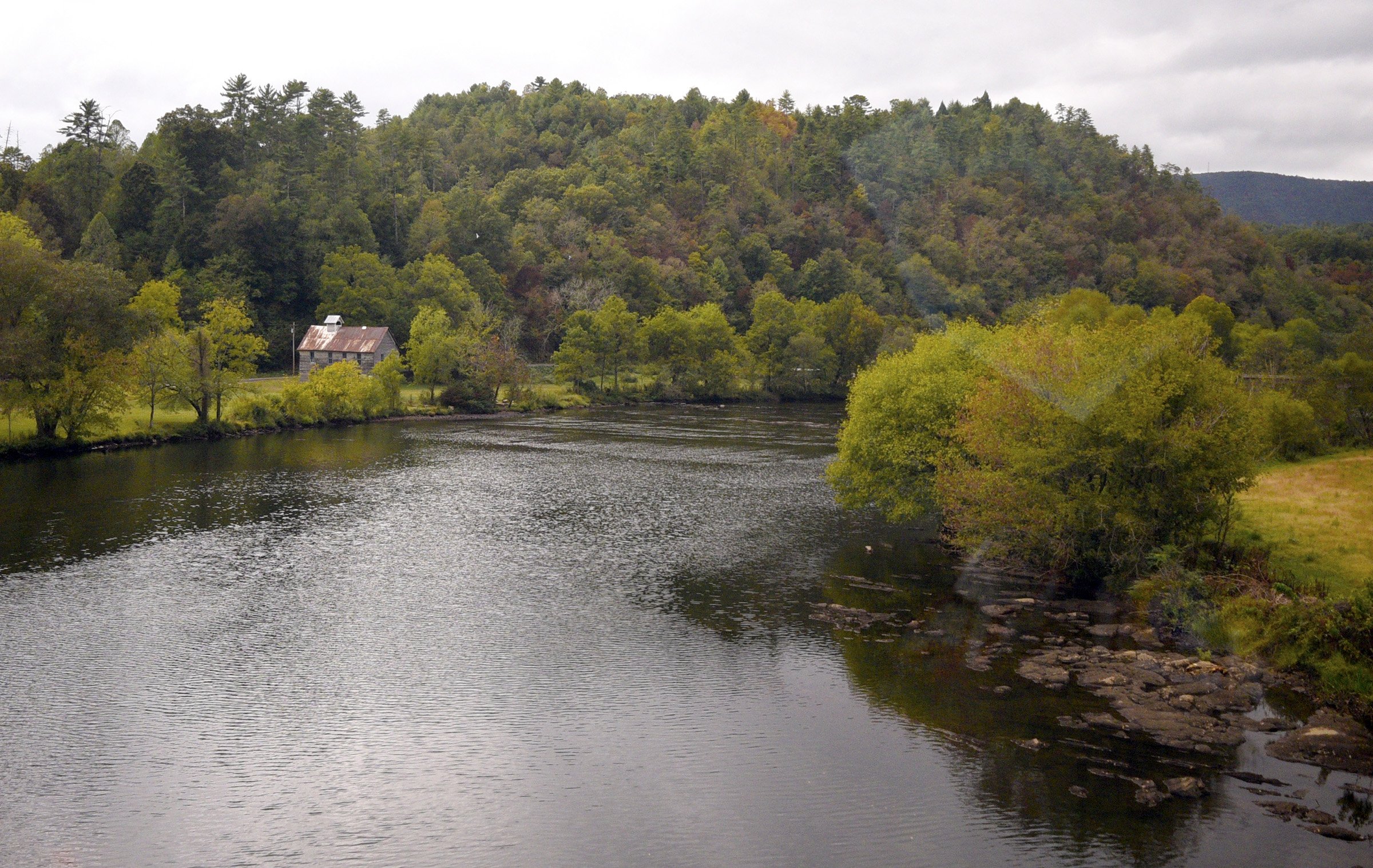 Staff Photo by Robin Rudd/ The train crosses the Hiwassee River just east of Reliance.