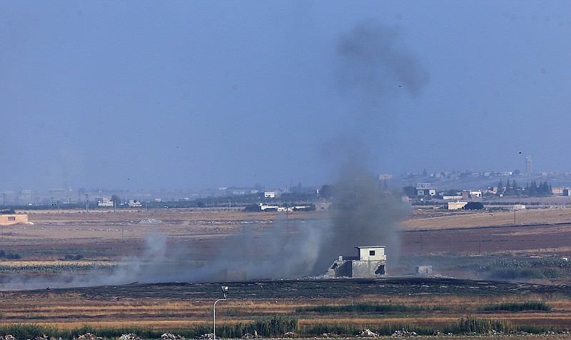 Photo by Lefteris Pitarakis of The Associated Press/In this photo taken from the Turkish side of the border between Turkey and Syria, in the Akcakale, Sanliurfa province, southeastern Turkey, smoke billows from a target inside Syria during bombardment by Turkish forces on Wednesday.