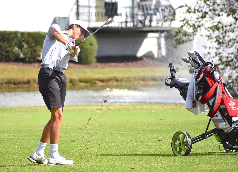 Staff photo by Patrick MacCoon / Signal Mountain senior Ben Seay hits a fairway iron shot on hole No. 13 during the final round of the Division I Small Class state championship in Manchester on Wednesday. The Eagles repeated as champions and set a new state record.