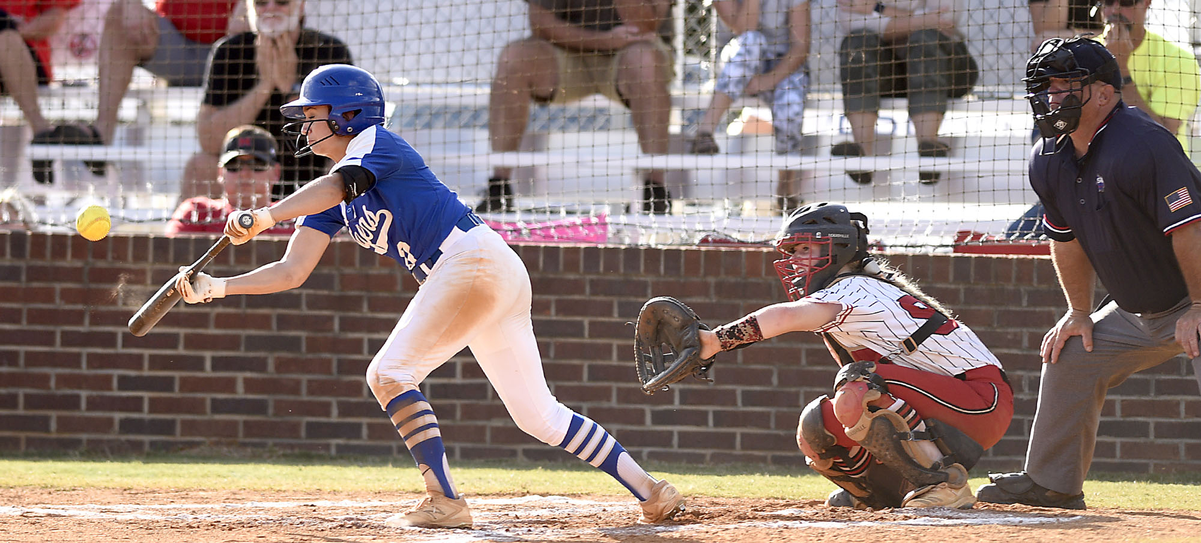 Staff Photo by Robin Rudd/ Ringgold's Taylor Layne (0) lays down a bunt for a base hit. The Ringgold Lady Tigers hosted the Morgan County Lady Bulldogs in the GHSA state softball tournament on October 9, 2019.