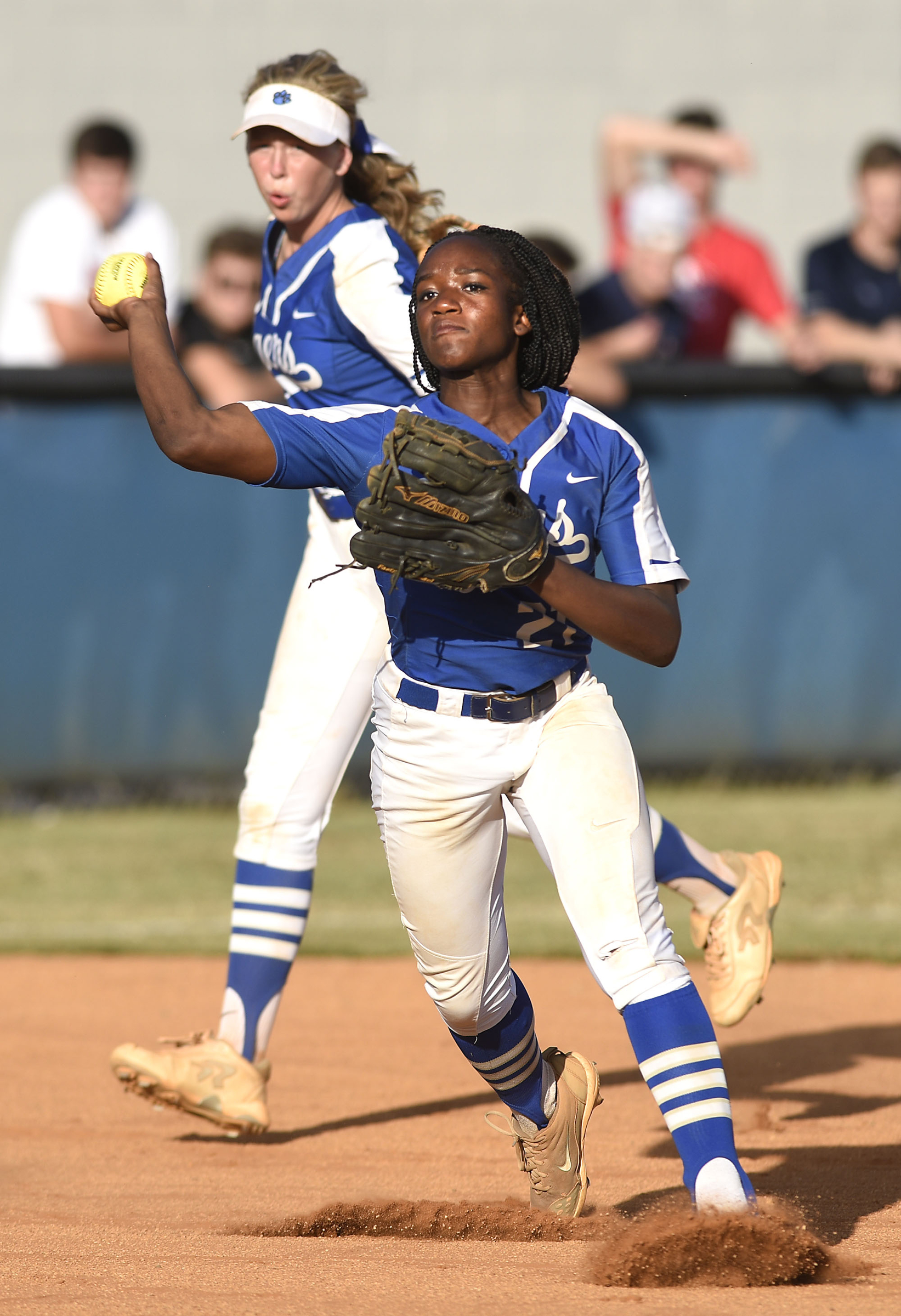 Staff Photo by Robin Rudd/ Ringgold third baseman Jade Gainer (21) throws out a Morgan County runner as shortstop Riley Nayadley (2) looks on. The Ringgold Lady Tigers hosted the Morgan County Lady Bulldogs in the GHSA state softball tournament on October 9, 2019.