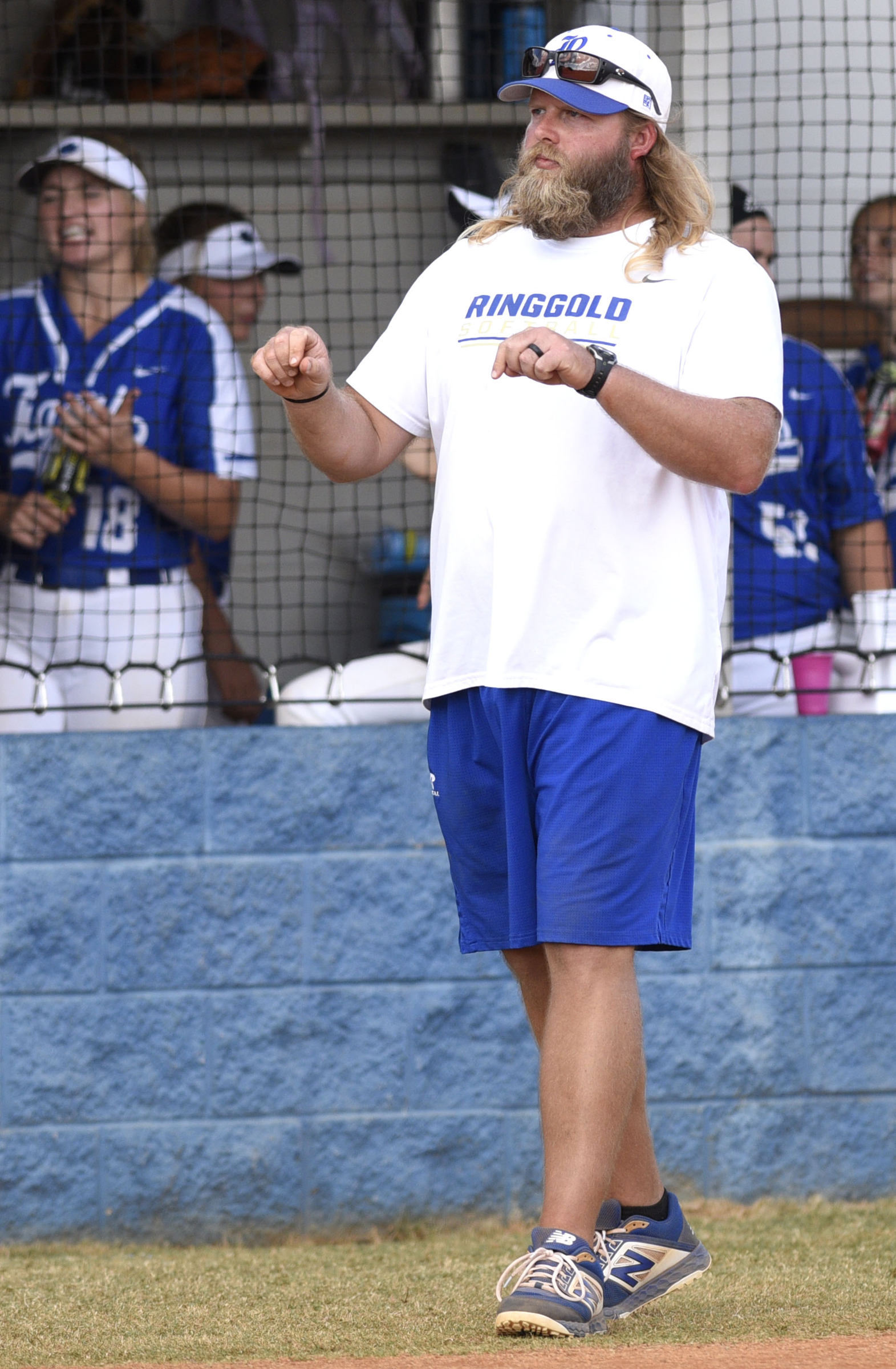 Staff Photo by Robin Rudd/ Ringgold head coach Daniel Hackett gives the sign to a batter. The Ringgold Lady Tigers hosted the Morgan County Lady Bulldogs in the GHSA state softball tournament on October 9, 2019.