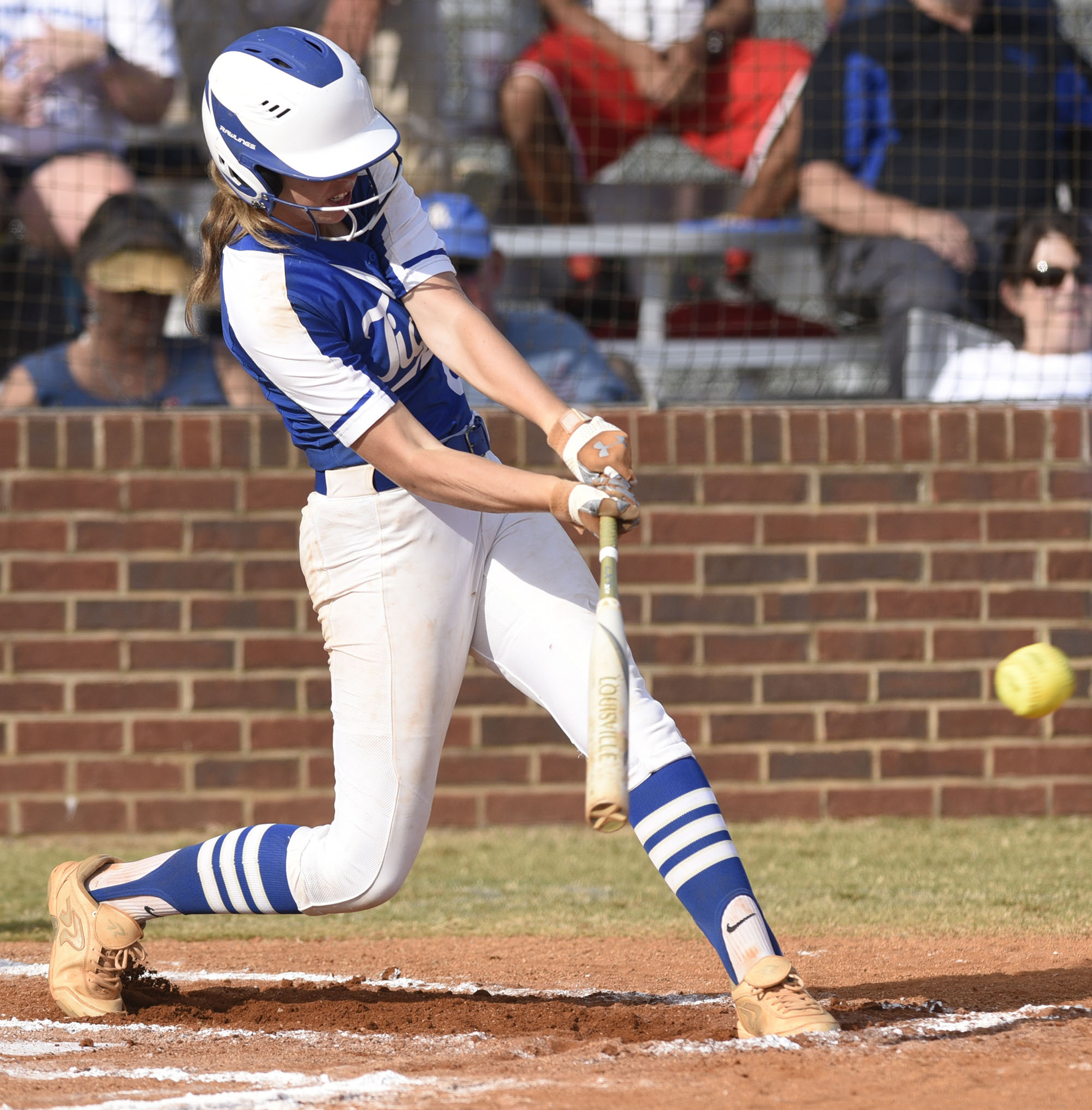 Staff Photo by Robin Rudd/ Ringgold's Riley Nayadley (2) slams a base hit. The Ringgold Lady Tigers hosted the Morgan County Lady Bulldogs in the GHSA state softball tournament on October 9, 2019.