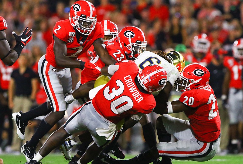 Georgia photo by Tony Walsh / The Georgia Bulldogs rank fifth nationally in rushing defense and are the only FBS team yet to allow a rushing touchdown this season.