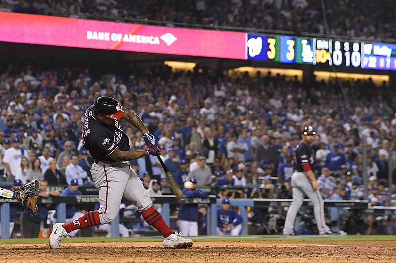 Washington Nationals' Howie Kendrick hits a grand slam against the Los Angeles Dodgers during the 10th inning in Game 5 of a baseball National League Division Series on Wednesday, Oct. 9, 2019, in Los Angeles. (AP Photo/Mark J. Terrill)