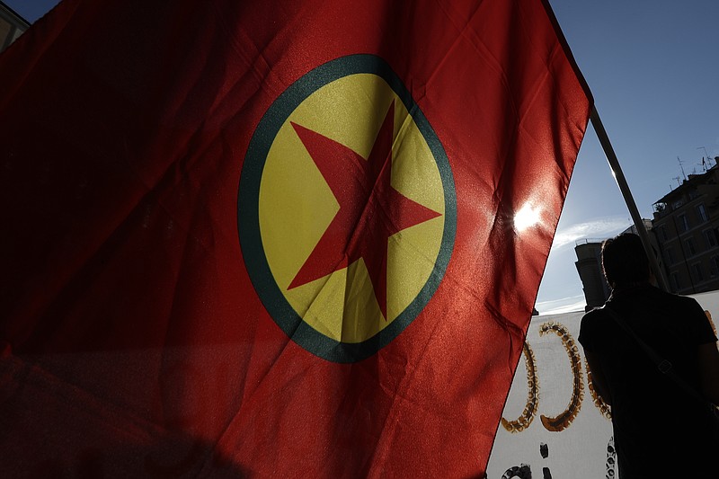 Photo by Andrew Medichini of The Associated Press/Pro Kurdish activist wave a Kurdistan Workers Party flag and shout slogans as they protest against Turkish military operation on Wednesday. Syria's Kurds accused the U.S. of turning its back on its allies and risking gains made in the fight against the Islamic State group as American troops began pulling back on Monday from positions in northeastern Syria ahead of an expected Turkish assault.