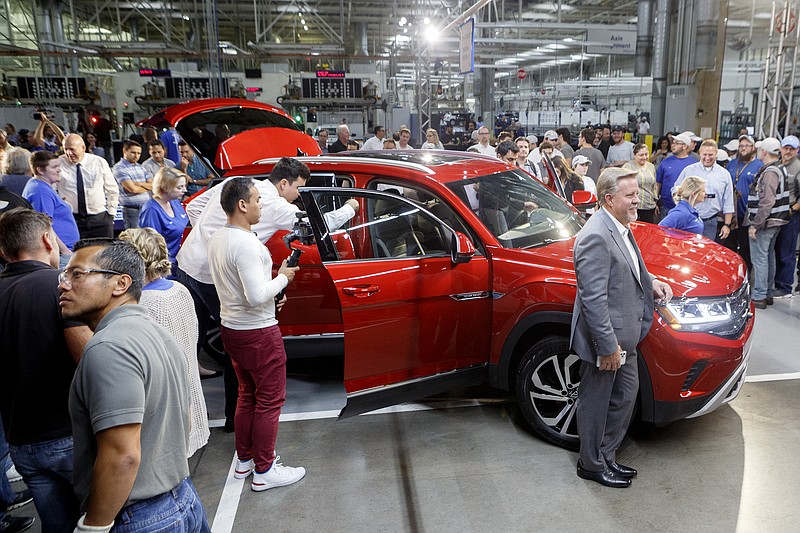 Staff photo by C.B. Schmelter / Attendees check out the 2020 Atlas Cross Sport at the Volkswagen Assembly Plant on Friday, Oct. 11, 2019 in Chattanooga, Tenn. The five-seat Atlas Cross Sport, which takes design cues from its larger seven-seat Atlas SUV, will hit dealerships early next year, according to the German automaker.