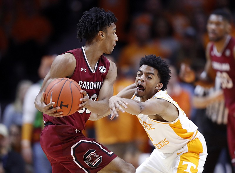 AP photo by Wade Payne / Tennessee guard Jalen Johnson attempts to steal the ball from South Carolina's A.J. Lawson during their SEC basketball game last February in Knoxville.