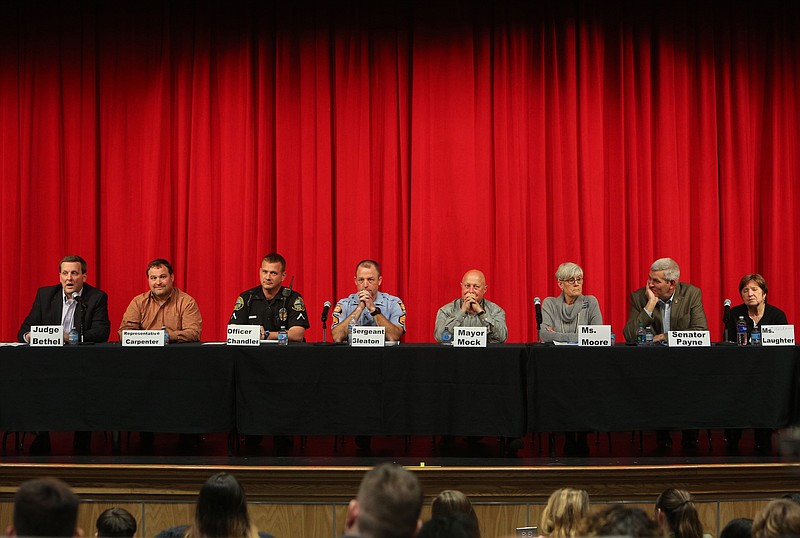 Staff photo by Erin O. Smith / 
Judge Charlie Bethel, Rep. Kasey Carpenter, Officer Bart Chandler, Sgt. First Class D.C. Gleaton, Dalton Mayor Dennis Mock, Bonnie Moore, Sen. Chuck Payne and Chairwoman Lynn Laughter serve as panelists during a public forum on gun safety at Dalton High School Monday, March 26, 2018 in Dalton, Ga. The forum gave students the opportunity to ask a variety of questions to state and community leaders, including topics on mental health, proactive measures and guns themselves. 