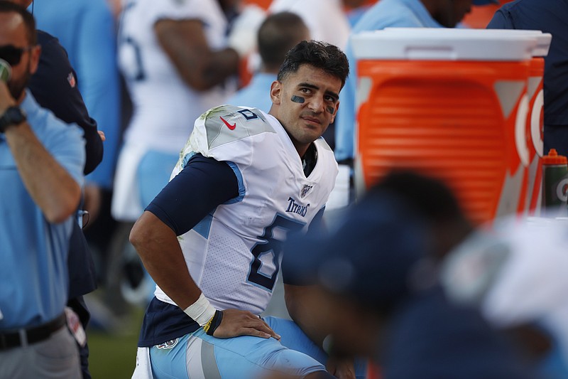 AP photo by David Zalubowski / Tennessee Titans quarterback Marcus Mariota looks on from the sideline during the second half of Sunday's 16-0 loss to the host Denver Broncos.