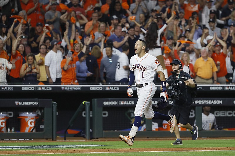 AP photo by Matt Slocum / The Houston Astros' Carlos Correa celebrates after his walk-off home run against the New York Yankees in the 11th inning of Game 2 of the ALCS on Sunday night.