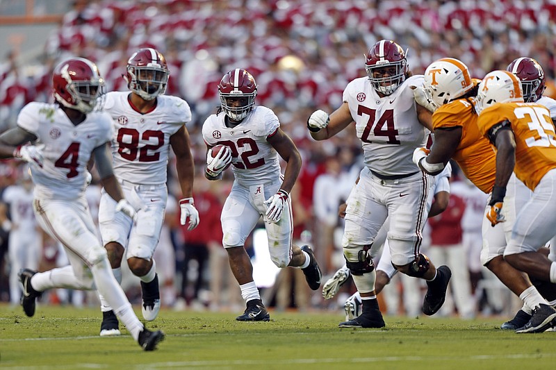 Alabama running back Najee Harris (22) runs for yardage in the second half of an NCAA college football game against Tennessee Saturday, Oct. 20, 2018, in Knoxville, Tenn. Alabama won 58-21. (AP Photo/Wade Payne)