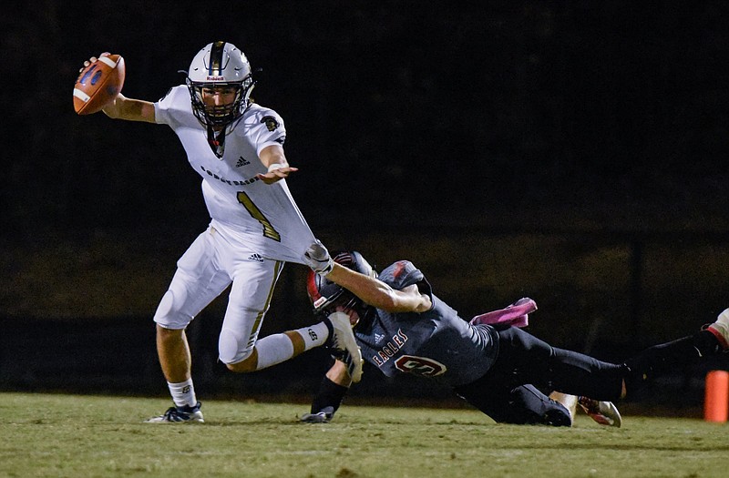 Photo by Cade Deakin/ Soddy Daisy's Isaac Barnes (1) evades a sack during the first half. The Soddy Daisy Trojans visited The Signal Mountain Eagles in TSSAA football action on Oct. 11, 2019.