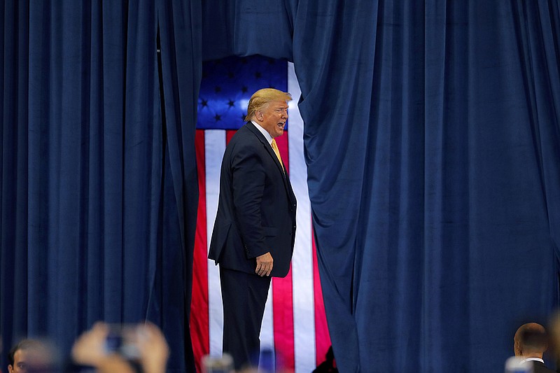 President Donald Trump acknowledges the crowd after speaking at a campaign rally in Lake Charles, La., Friday, Oct. 11, 2019. (AP Photo/Gerald Herbert)