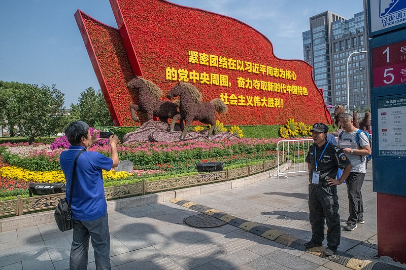 Photo by Gilles Sabriéof The New York Times/A floral arrangement encourages passers-by to unite behind the leadership of President Xi Jinping of China in advance the country's National Day celebration, in Beijing, on Sept. 20, 2019, to mark the 70th anniversary of the Communist Party's rule comes