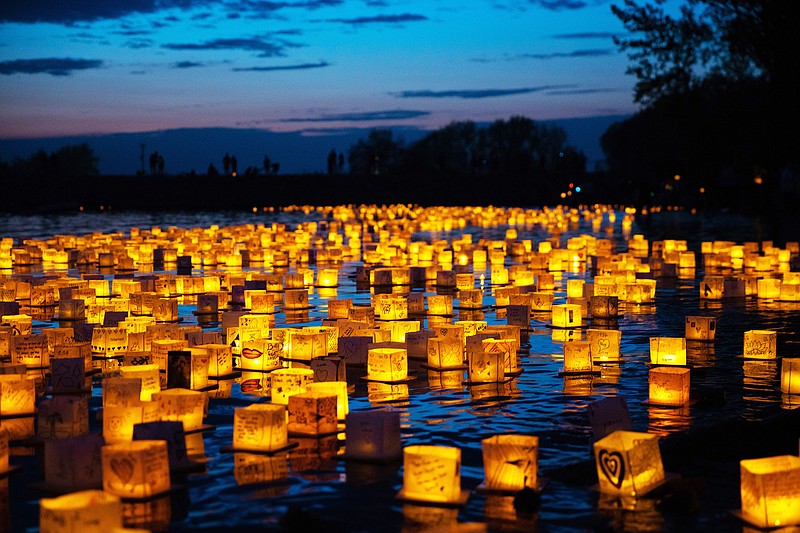Hundreds of lanterns reflecting in the water make beautiful photo-ops at a Water Lantern Festival. / Water Lantern Festival Contributed Photo