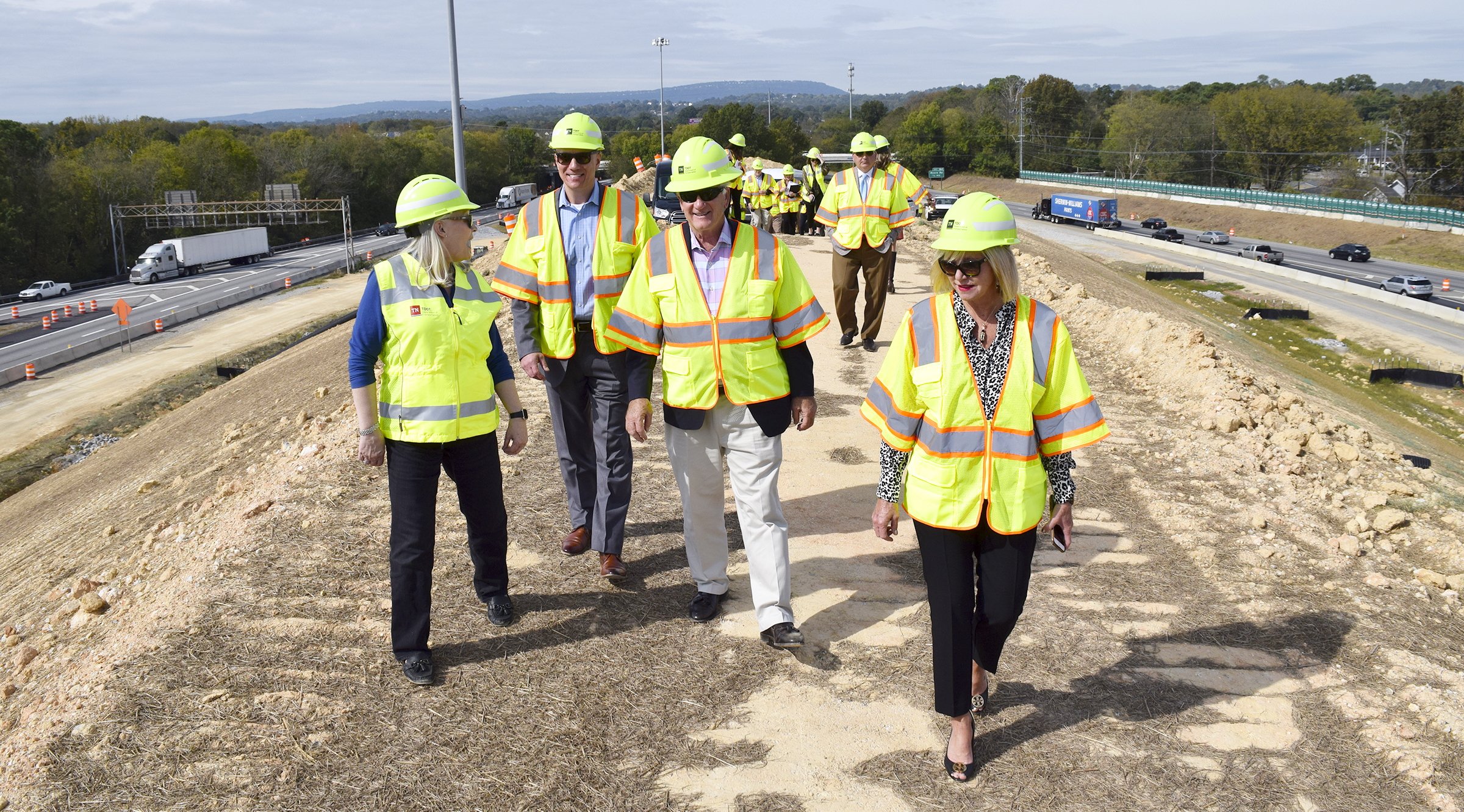 Staff Photo by Robin Rudd/ From left, Jennifer Flynn Region 2 Community Relations Officer, takes State Representative Mark Hall, State Senator Todd Gardenhire and State Representative Esther Helton on a tour of "Mount Matthews" in the center of the highway project. Mount Matthews is the playful name given to the large mount between I-75 and I-24. Tennessee Department of Transportation Commissioner Clay Bright, along with state and local elected officials, visited the I-75/I-24 interchange modification project in Chattanooga, Hamilton County on Tuesday, October 15, 2019.