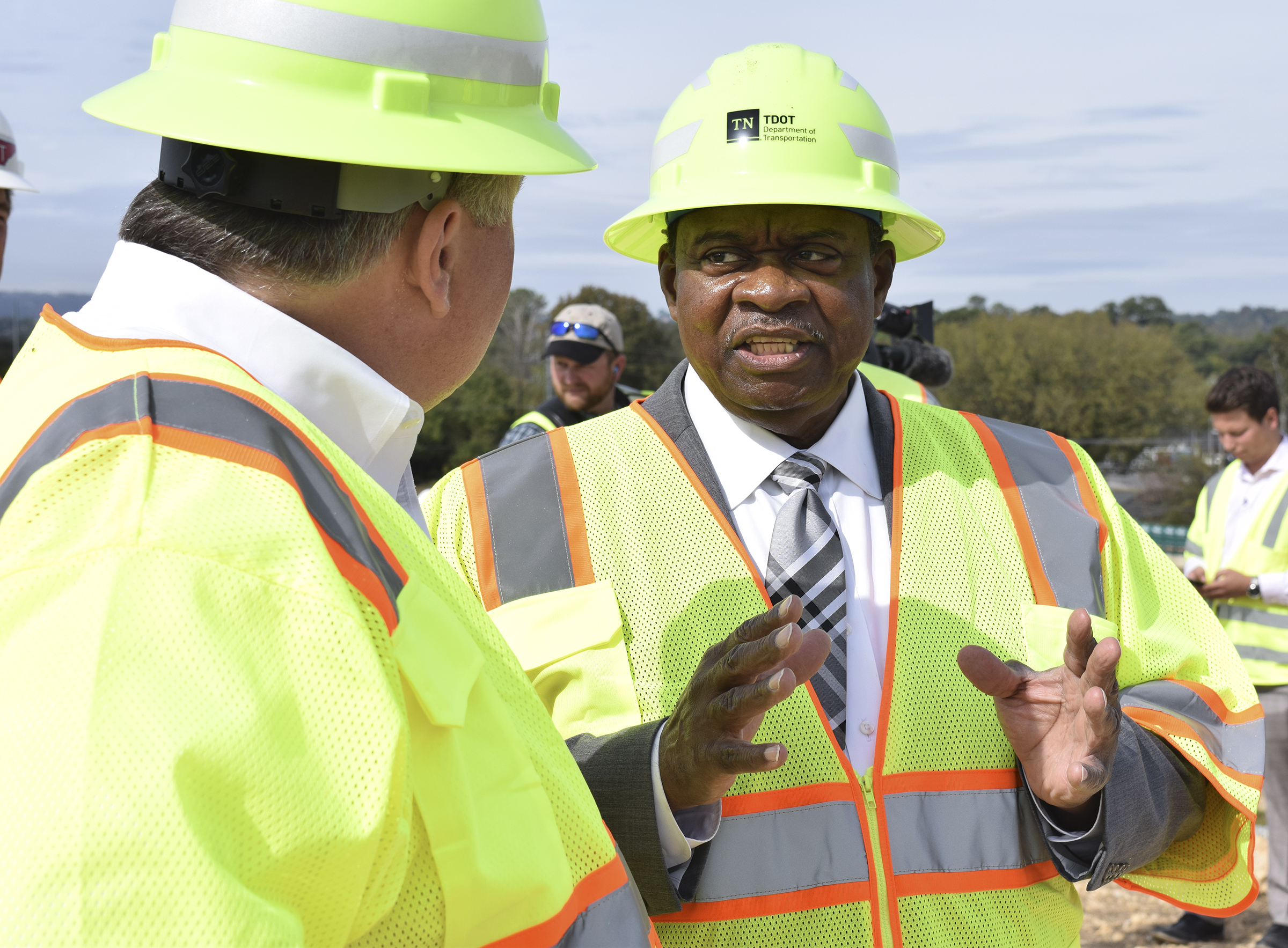 Staff Photo by Robin Rudd/ Tennessee State Representative Yusuf Hakeem, right, talks with Brian Carroll TDOT Legislative Director. Tennessee Department of Transportation Commissioner Clay Bright, along with state and local elected officials, visited the I-75/I-24 interchange modification project in Chattanooga, Hamilton County on Tuesday, October 15, 2019.