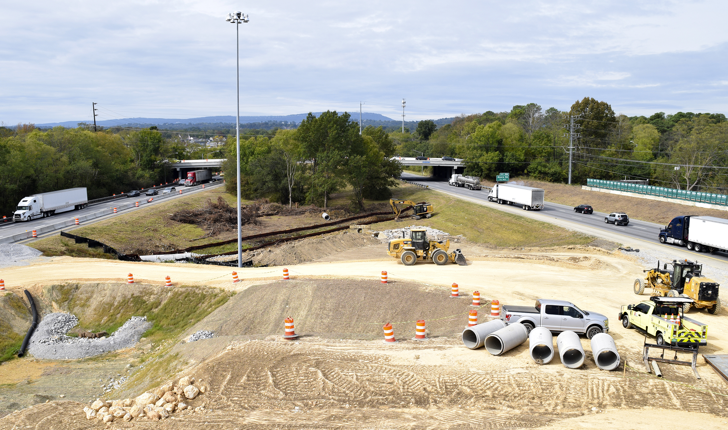Staff Photo by Robin Rudd/ With Lookout Mountain in the background Spring Creek Road crosses Interstate 24 at the I-75/I-24 interchange. Tennessee Department of Transportation Commissioner Clay Bright, along with state and local elected officials, visited the I-75/I-24 interchange modification project in Chattanooga, Hamilton County on Tuesday, October 15, 2019.
