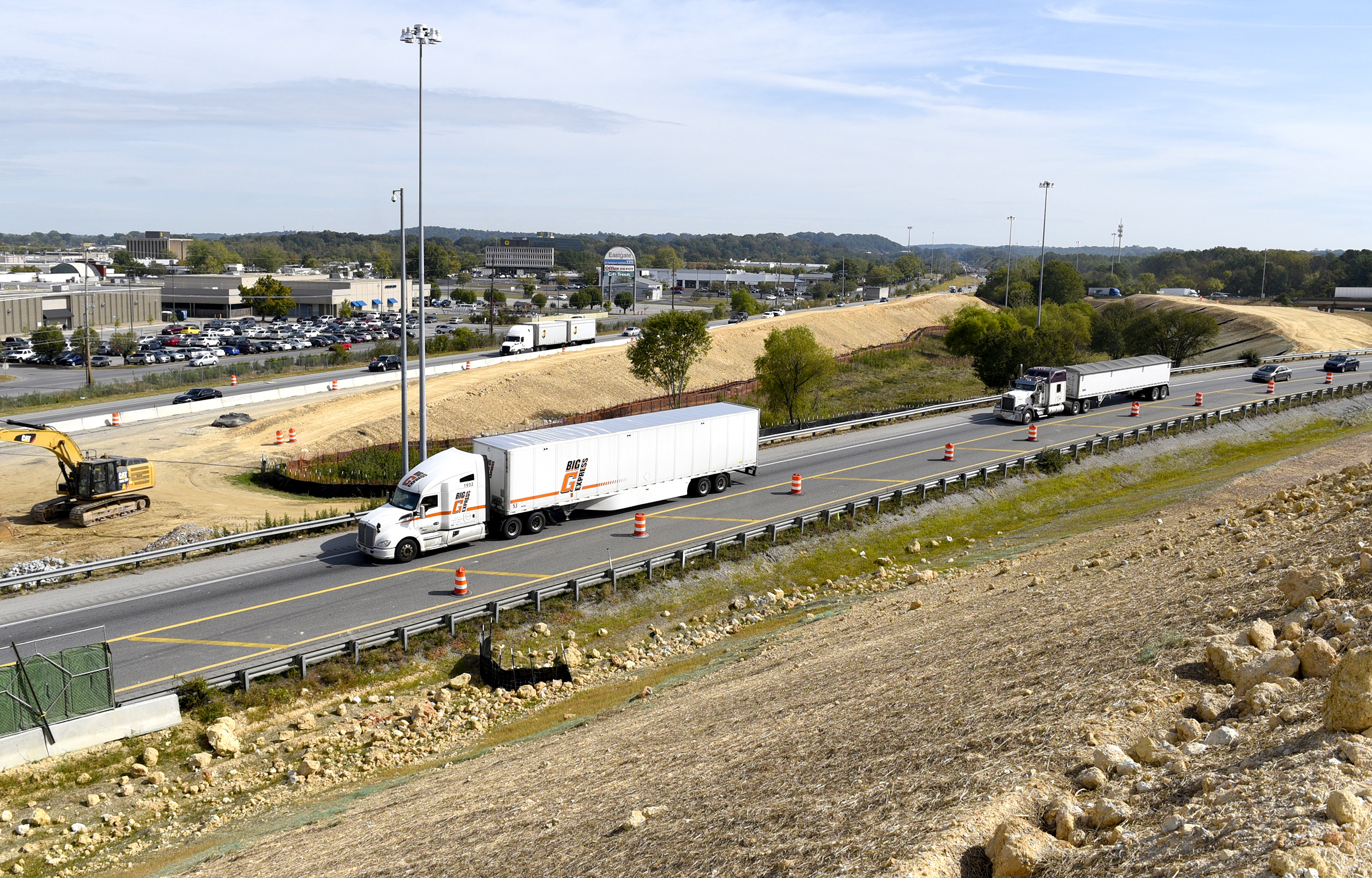 Staff Photo by Robin Rudd/ With Eastgate in the background traffic passes along I-75 and I-24 at thier interchange. Tennessee Department of Transportation Commissioner Clay Bright, along with state and local elected officials, visited the I-75/I-24 interchange modification project in Chattanooga, Hamilton County on Tuesday, October 15, 2019.