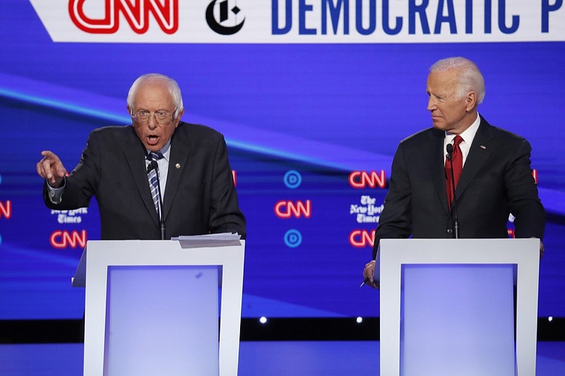 Democratic presidential candidate Sen. Bernie Sanders, I-Vt., left, speaks as former Vice President Joe Biden listens during a Democratic presidential primary debate hosted by CNN/New York Times at Otterbein University, Tuesday, Oct. 15, 2019, in Westerville, Ohio. (AP Photo/John Minchillo)


