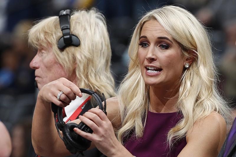 AP photo by David Zalubowski / Sarah Kustok, television color analyst for the Brooklyn Nets, prepares for the first half of a game in Denver in November 2018.