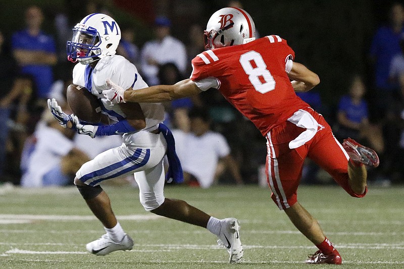 Staff photo by C.B. Schmelter / McCallie's Eric Rivers (11) pulls in a 33-yard pass against Baylor's Riley Jenne during a game hosted by Baylor on Oct. 4.
