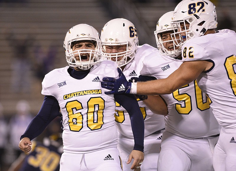 Staff Photo by Robin Rudd / UTC kicker Victor Ulmo (60) celebrates with his teammates after making the winning field goal in a 16-13 victory over ETSU on Thursday night at Finley Stadium.