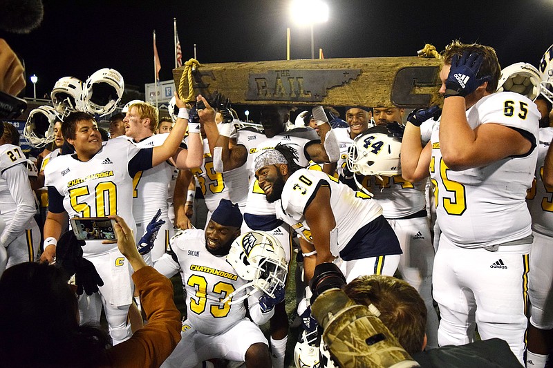 Staff Photo by Robin Rudd/  UTC players celebrate with the Rail.  The Rail is the trophy for whoever wins the UTC/ East Tennessee game.  The University of Tennessee at Chattanooga Mocs hosted the East Tennessee State University Buccaneers in Southern Conference football at Chattanooga's Finely Stadium on October 17, 2019.